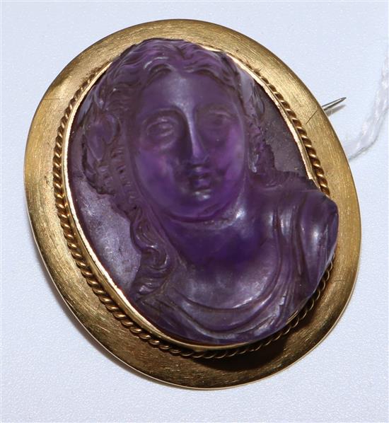 A gold mounted amethyst portrait brooch, 33mm(-)